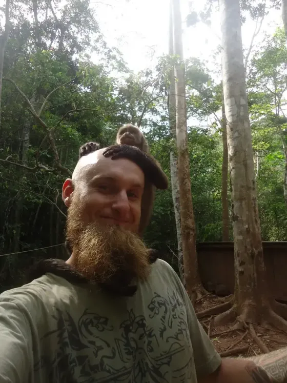 A monkey perched on Lukas’s head